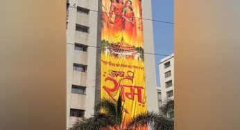 115-foot-high flag of Lord Ram hangs on a building in Gujarat