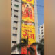115-foot-high flag of Lord Ram hangs on a building in Gujarat
