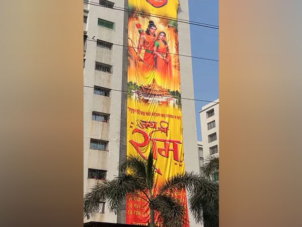 115-foot-high flag of Lord Ram hangs on a building in Gujarat