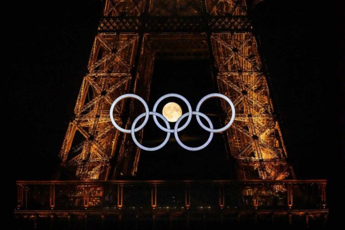 Eiffel Tower Adorned with Olympic Rings Ahead of Opening Ceremony