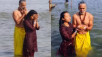 Milind Soman Takes Holy Dip In Sangam With Wife Ankita Konwar At Mahakumbh