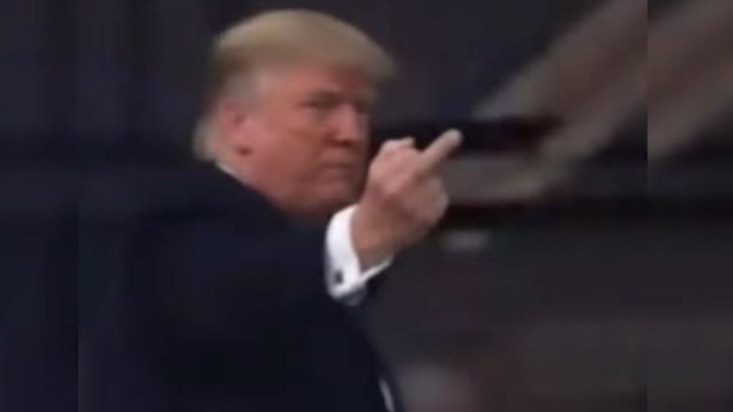 Trump Gestures at Heckler