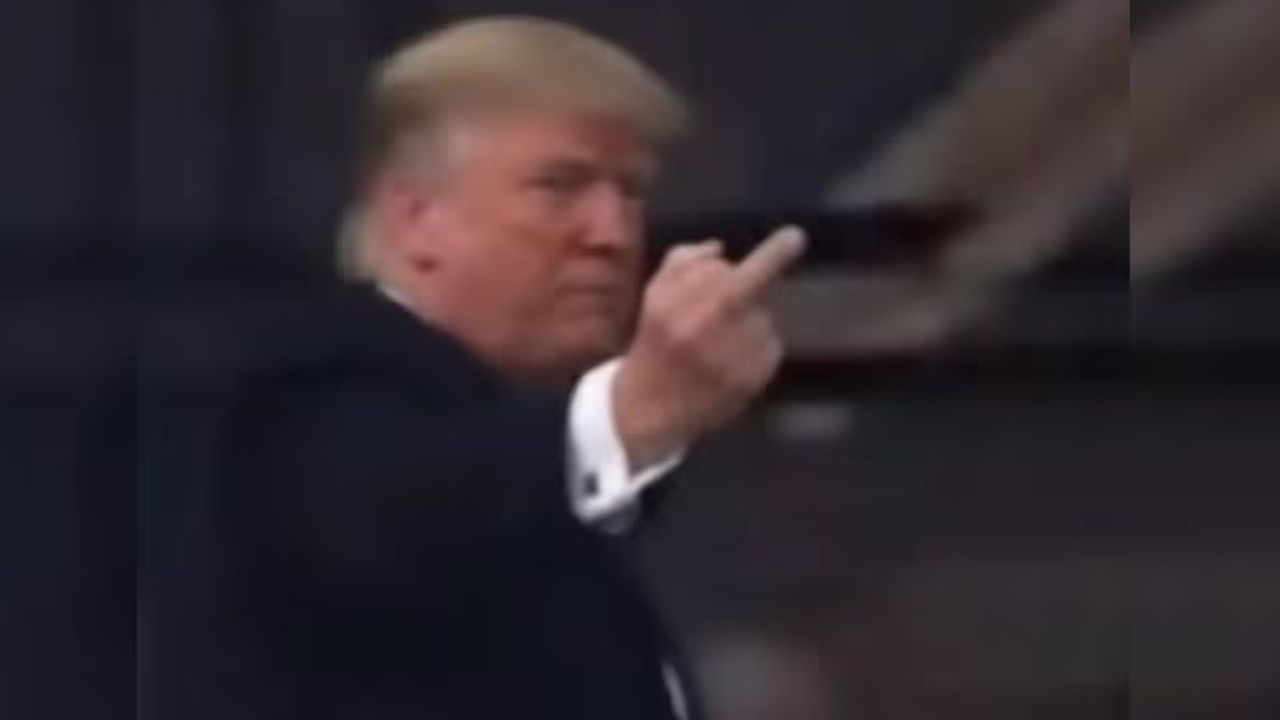 Trump Gestures at Heckler